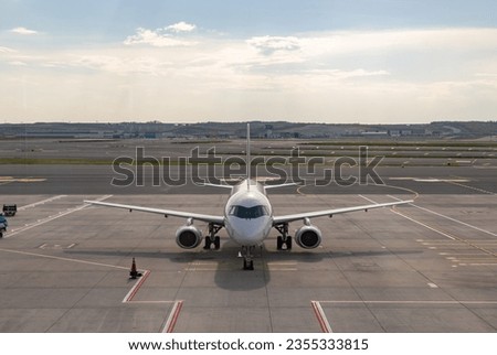 A picture of an airplane on the runway.
