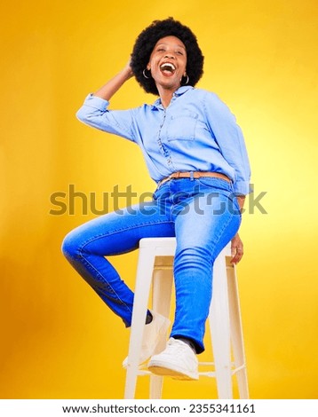 Black woman, smile and portrait on a chair in studio, yellow background or natural happiness with casual fashion and style. African, gen z or model relax with laugh for creative, mockup or space