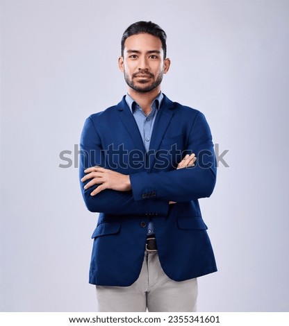 Portrait, serious and business man with arms crossed in studio isolated on a white background mockup space. Professional, entrepreneur and confident worker, employee and Mexican consultant in suit. Royalty-Free Stock Photo #2355341601