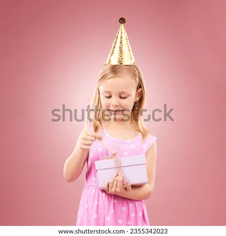 Present, birthday hat and child open gift box for holiday party or happy celebration. Excited girl on a pink background for surprise, giveaway prize or celebrate win at event with a ribbon and joy
