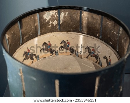 A zoetrope is a device that makes still images appear as if they are moving.