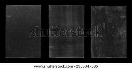 Old Black Empty Aged Damaged Paper Cardboard Photo Card Isolated on Black. Real Halftone Scan. Folded Edges. Rough Grunge Shabby Scratched Torn Ripped Texture. Distressed Overlay Surface for Collage Royalty-Free Stock Photo #2355347585