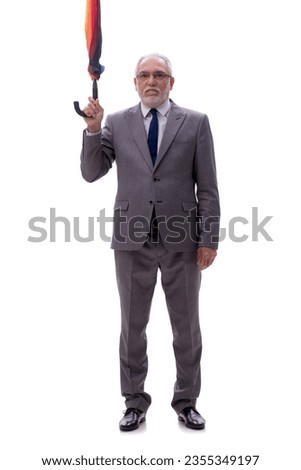 Old businessman holding an umrella isolated on white