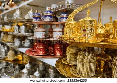 Handicraft beaded decorate arabic style tea cups. Golden colored traditional middle-eastern tea set. Turkish traditional teaware