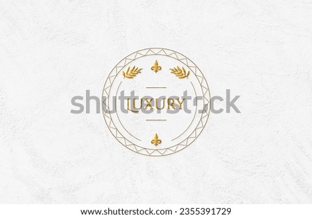 logo mockup on white plaster in golden color