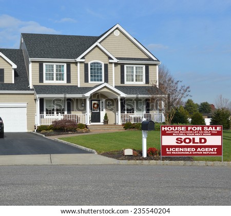 Real Estate Sold (another success let us help you buy sell your next home) sign uburban Mcmansion home residential neighborhood USA