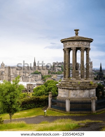 Dugald Stewart Monument on calton hill and the beautiful scottish city of Edinburgh in the background