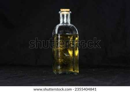 white wine bottle under black background