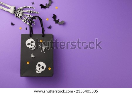 Delight your loved ones with Halloween gifts. Top view arrangement of mysterious package, creepy skeleton hands, scary decor on purple background with advertising zone