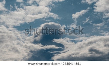 Cumulus clouds in the sky. Formation of a cyclone. Background picture.