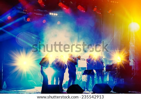 Ensemble Playing Night Concert On The Stage. Jazz music. Royalty-Free Stock Photo #235542913