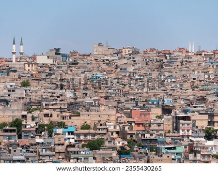 Hills and their dense cityscane surrounding of Gaziantep, Turkey seen from the Old Town - Landscape shot 1