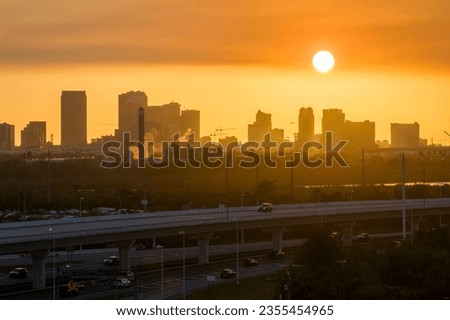 Urban sunset landscape of downtown district of Tampa city in Florida, USA. Dramatic skyline with high skyscraper buildings in modern american megapolis