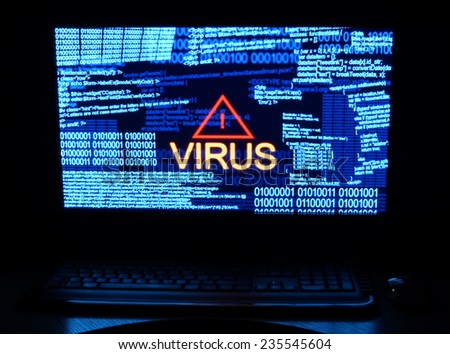 Computer in dark with word virus Royalty-Free Stock Photo #235545604