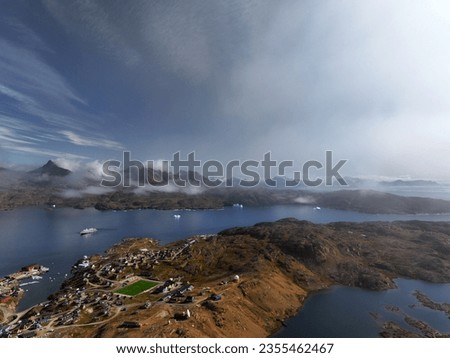 aerial view of arctic ocean fjord and mountains