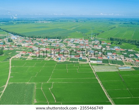 Aerial panoramic view of the village and surrounding farmland