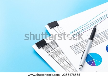 Work documents on blue background.
Translation:year,company