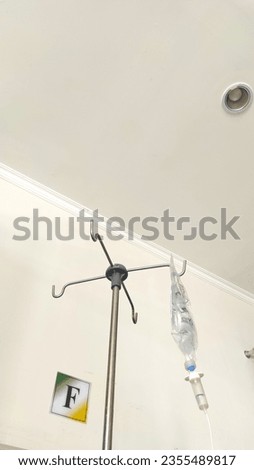 Health and Medical Photography. Photo of IV stand and curtain. Each patient room has an infusion support device and curtains as a partition. Bandung - Indonesia