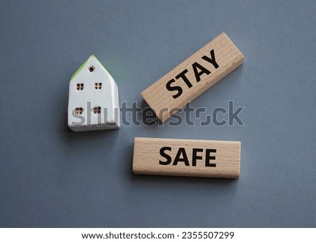Stay Safe symbol. Concept word Stay Safe on wooden blocks. Beautiful grey background. Business and Stay Safe concept. Copy space