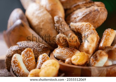 Artisanal Bakery Delights. Close-Up of Breads and Baked Goods Royalty-Free Stock Photo #2355512069