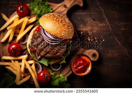 Elevated view of a mouth-watering hamburger with chips, set on a rustic surface with copy space. Royalty-Free Stock Photo #2355541605