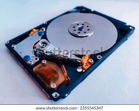 Of hard disk drive HDD isolated on bluish white background with soft shadow.