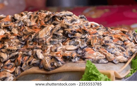 a photography of a large pile of food on a table, polyporus frondosus on a pizza with lettuce and tomato.