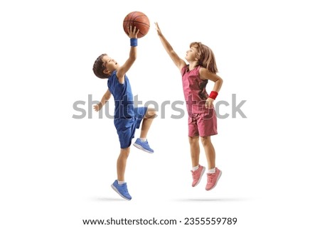 Little boy and girl playing basketball isolated on white background Royalty-Free Stock Photo #2355559789