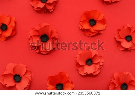 Many poppy flowers on red background. Remembrance Day in Canada