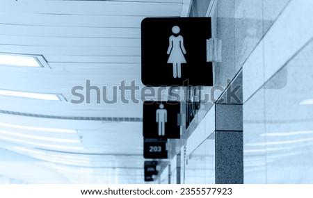 Men's and women's toilet sign on the wall