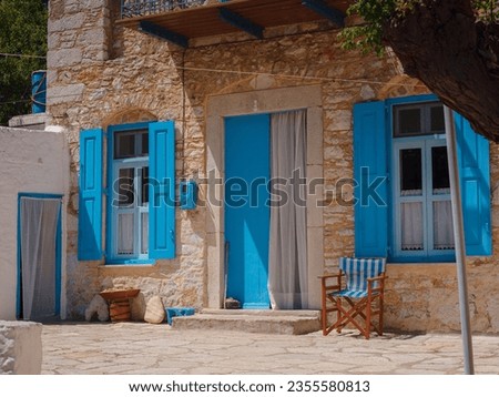 Cute details of windows, doors, balconies from old house in Simi island . Greece islands holidays from Rhodos in Aegean Sea. Colorful neoclassical houses in bay of Symi. Holiday travel background.