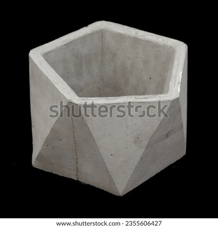polygonal planter made of concrete on a black background	