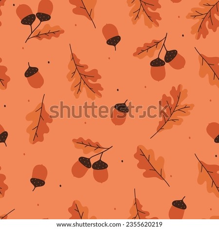 Seamless pattern with autumn oak leaves and acorns on a orange background. Vector graphics.
