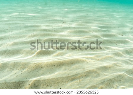 Seafloor made of sand in the sun Royalty-Free Stock Photo #2355626325