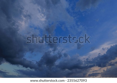 Dark blue sky with rain clouds