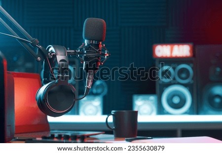 Professional microphone and headphones at the radio station, entertainment and communication concept