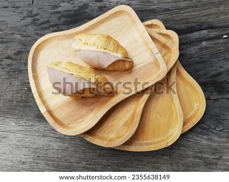 Mini Ham and Cheese Croissants on Wooden Plate Royalty-Free Stock Photo #2355638149