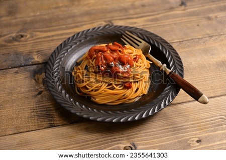 Spaghetti alla sassina with canned whole tomatoes