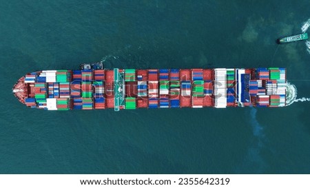 Aerial top view of cargo container ship carrying container from custom container depot go to ocean concept freight shipping by ship service on blue sky .Freight Forwarding Service