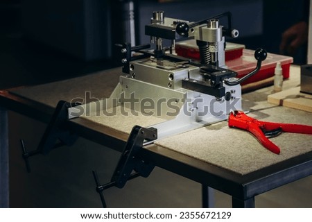 Machine and tools for assembling army knives