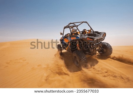 sand dune bashing offroad. utv rally buggy Royalty-Free Stock Photo #2355677033