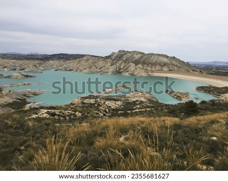 Aljeciras's ramble reservoir with its blue waters and white mountains in Murcia