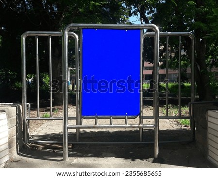 Blank empty signage on school entrance and exit, blank billboard, new advertisement on fence, large copy space, blank banner empty signage pinned to wall of outdoor construction pathway