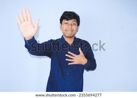 smiling asian man heart attack survivor is raised his hands as stop signs gesture and hold his chest to campaign stop unhealthy lifestyle wear navy shirt