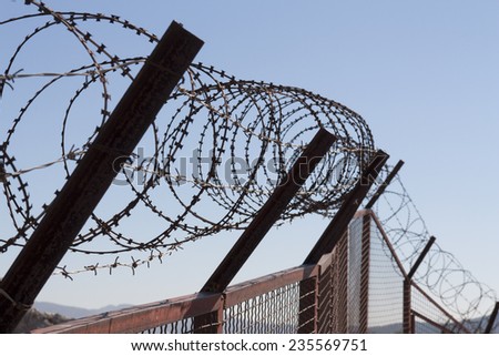 Security with a barbed wire fence photo. Protection concept design. 