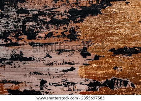 Abstract wall painting with black oil strokes and glow shine gold bronze texture background. Contemporary art. Modern design
