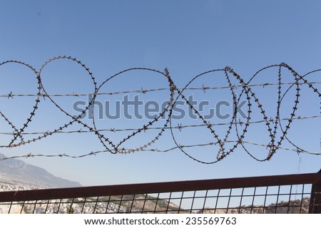 Security with a barbed wire fence photo. Protection concept design. 