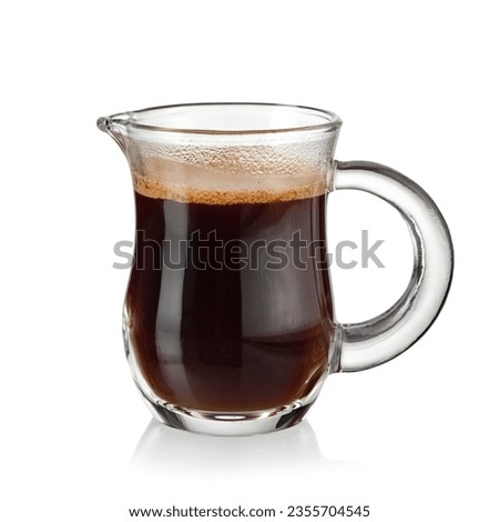 Hot espresso coffee in a small glass jug on white background Royalty-Free Stock Photo #2355704545