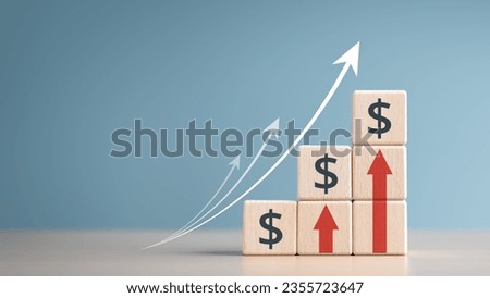 Interest finance or mortgage rates. Wooden blocks with currency symbols and arrow pointing up icons. Financial growth, Deposit interest increase, inflation, sale price and dollar exchange rate rise.