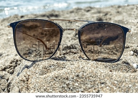 glasses-a beautiful photo with a sea-sand view